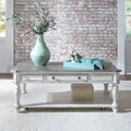 Rectangular Cocktail Table in Antique White with Weathered Top Turned Legs Casters and Bottom Shelf